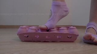 Crushing Egg Carton Wearing Yoga Socks