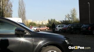 Squatting Between Parked Cars To Piss In Public