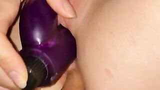 Wife plays with toy while husband fingers her ass