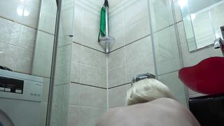 Slim MILF with a big booty in the shower.