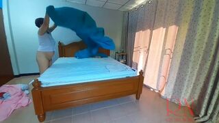 Nudist housekeeper Regina Noir makes the bedding in the bedroom. Naked maid. Naked housewife. 2