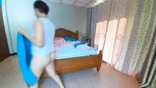 Nudist housekeeper Regina Noir makes the bedding in the bedroom. Naked maid. Naked housewife. 2