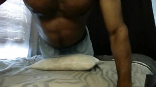 Fit guy dry humping his cock against the bed