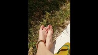 Feet solo in the garden while masturbating