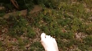 Feet solo in the garden while masturbating