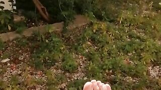 Feet solo in the garden while masturbating