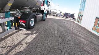 Pissing against a truck tire