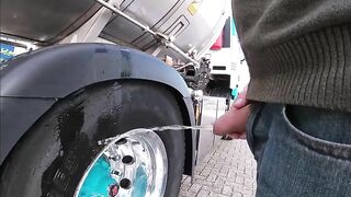 Pissing against a truck tire