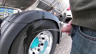 Pissing against a truck tire