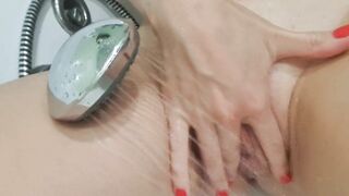 MILF caresses a big clitoris in the shower and gets a sweet orgasm