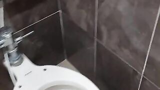 Pissing in the bathroom of the mall