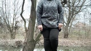 Doggystyle pissing of a woman who wears pantyhose under her pants