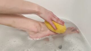 Washing feet in bubble bath