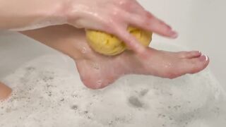 Washing feet in bubble bath