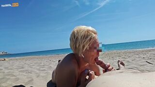 Blowjob on a public beach