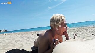 Blowjob on a public beach