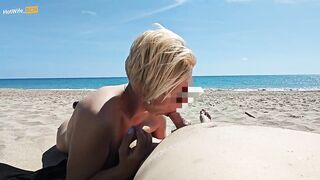 Blowjob on a public beach