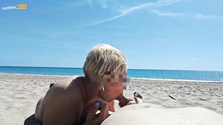 Blowjob on a public beach