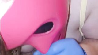 She sucks my cock through her pink purge mask