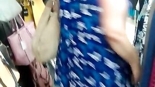 BBW milf flashing tits in a clothing store