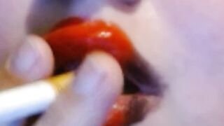 Red Heart Lipstick And Smoking Upclose