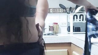 My stepbrother's wife is in the kitchen, I fuck her with my strap-on and then she sucks my strap-on.