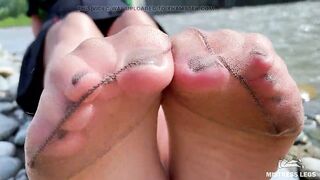 Goddess In Tan Nylons Show Her Cute Nylon Soles And Toes On The Riverside