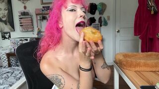 eating a donut i made while topless