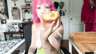 eating a donut i made while topless